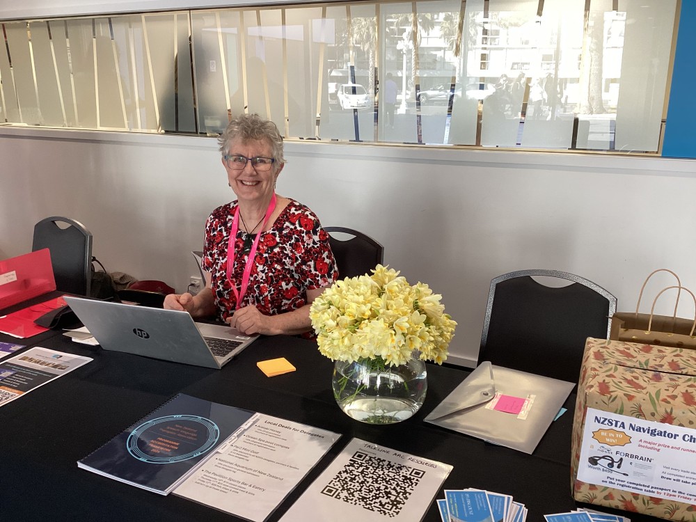 Caption  NSTA kaiwhakahaere matua Siobhan Molloy at the registration table 1 v2